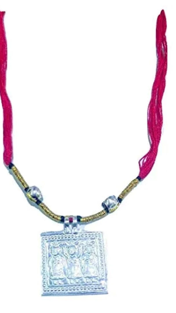 A close-up view of an Ahoi locket adorned with pearls.